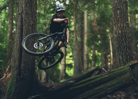 Mountain biker in forest using Internal Routing MTB Dropper Post With Adjustable Travel, 30.9mm Diameter, 175mm Length