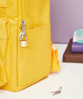 Two Pack Small Solid Brass Padlocks With Keys 20mm And 25mm Mini Key Locks for luggage security on yellow backpack zipper