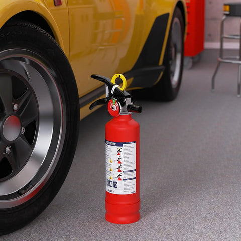 No Fuss ABC Home Fire Extinguisher 2.5 Lb Two Pack Top Shelf Rated Class A B C For Kitchen Garage next to a yellow car.