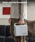 Person holding a HOTO 25 Piece Household Tool Kit with 16V Brushless Drill in a portable case.
