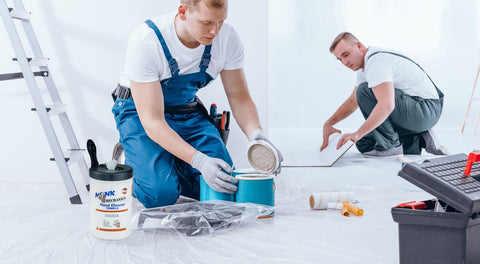 Men using Heavy Duty Mechanics Wipes For The Shop And Garage Large 10x12 Inch Towels For Multi Purpose Surface And Hand Cleaning 6 Canisters Of 72 Count Each Perfect For Removing Paint Oil Grease Dirt And Grime in a workshop.