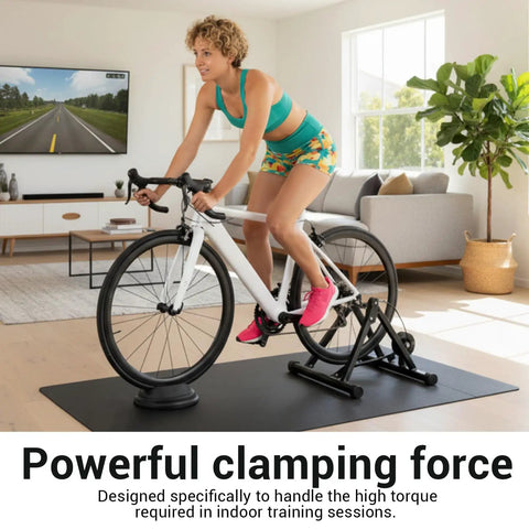 Indoor training setup with rider on a bike and Rapid Dope Quick Release Wheel Skewer for trainers, living room setting.