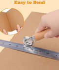 Person using Pro Grade Dual Size Box Resizer Tool Set With 0.5mm And 1.2mm CAMs for precise cardboard scoring with ruler