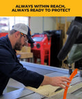Woodworker using 11th Finger Push Stick For Saw Protection And Finger Safety, Magnetic 10 Inch Orange Woodworking Pro Grade Tool