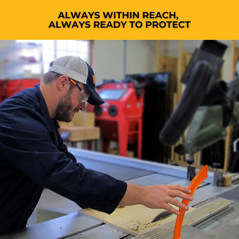 Woodworker using 11th Finger Push Stick For Saw Protection And Finger Safety, Magnetic 10 Inch Orange Woodworking Pro Grade Tool