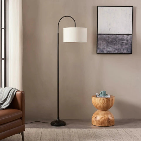 Nora Arc LED Tall Floor Lamp With Heavy Base For Living Room And Office next to round wooden table and sofa