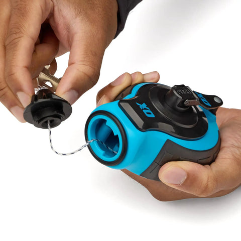 Hands holding Chalk Line Kit With 100 Ft Thick Line Curved Hook 6 To 1 Gear Ratio Metal Handle with open top load