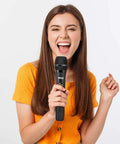 Person using Portable UHF Wireless Microphone System With Battery Power