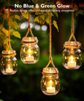 24 Pack Flameless LED Tea Lights Battery Operated Warm White Flickering Mini Candles hanging in jars outdoors