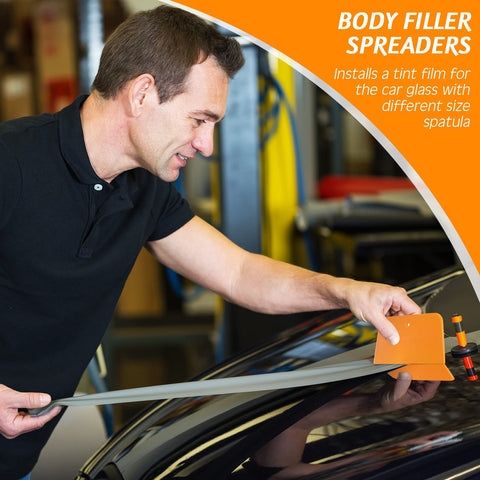Man using Six Piece Body Filler Spreaders Set For DIY Auto Body Repair on black car hood, holding trapezoid plastic tool.