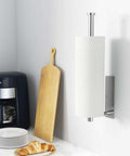 Stainless Steel Paper Towel Holder With Self Adhesive Or Drilling Mount Brushed Nickel Finish wall-mounted in a kitchen setting.