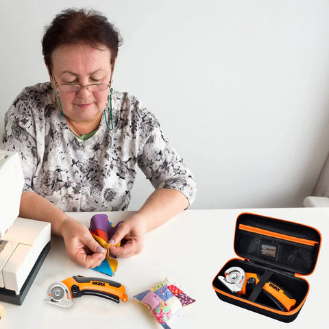 Woman using Compact, Rugged Tool Case For ZipSnip And SnapFresh Cordless Scissors With Zipper Mesh Pocket, orange tools visible.