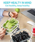 Glass Meal Prep Storage Containers Set 22 Oz Each 10 Pack With Airtight BPA Free Lids, shown with salad and fruits on desk