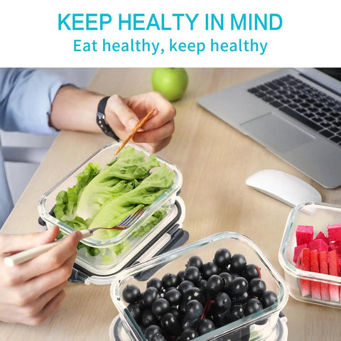 Glass Meal Prep Storage Containers Set 22 Oz Each 10 Pack With Airtight BPA Free Lids, shown with salad and fruits on desk