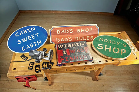 Four Inch Interlocking Router Letter Template Set For Dead Easy Comic Sans Custom Sign Making No Sweat Woodworking Stencils and Precision Alignment Guide Kit displayed on workbench with crafted signs.