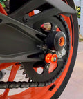 Two Pack 10mm M10x1.25 Motorcycle Swing Arm Sliders Spools CNC Swing Arm Stand Screw installed on rear wheel.