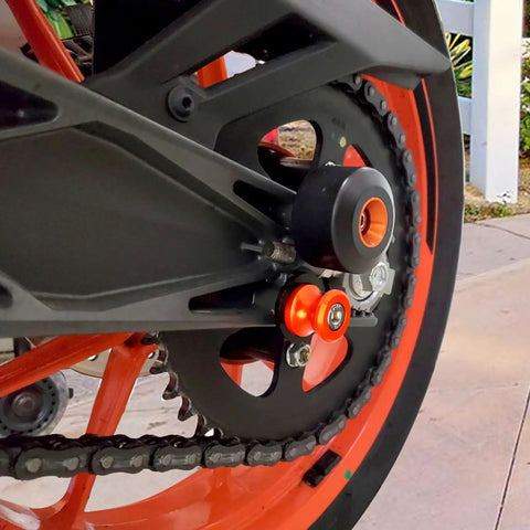 Two Pack 10mm M10x1.25 Motorcycle Swing Arm Sliders Spools CNC Swing Arm Stand Screw installed on rear wheel.
