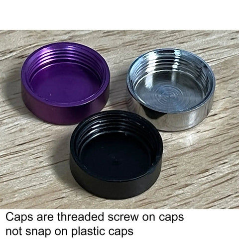 Three threaded caps in purple, black, and silver for Badass Stainless Steel License Plate Screws With Twist On Red Caps.