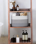 Grey decor woven rope storage basket on shelf, fits towels and accessories, part of the Woven Rope Storage Baskets Set Of 3 For Books Toys Towels And Magazines, Small Rectangle Organizer Bins For Bedroom Closet Living Room, 15 by 10 by 9 inches.