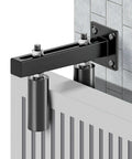 Installed 6 Inch Slide Gate Guide Roller With Adjustable UHMW Nylon Guider on metal fence, heavy duty hardware, black finish.