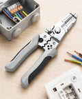 Heavy Duty Wire Stripper Pliers Manual Hand Tool with Stripping Cutting for electrical work on a workbench.