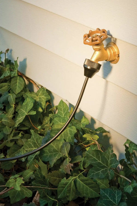 Patio Drip Irrigation Kit With Faucet Connection, 42-Piece Set connected to outdoor faucet with one quarter inch tubing.