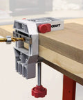 Joint Master Doweling Jig With Self-Clamping Aluminum Frame on wooden tabletop showing edge jointing with drill