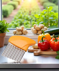 Crinkle cutter with orange handle and stainless steel ribbed blade for slicing vegetables.