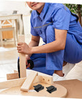 Man assembling furniture with space-saving folding hinge set for DIY projects.