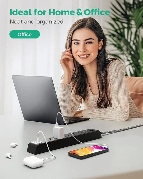 Woman using laptop with 12Foot Power Strip Surge Protector With 6 Outlets And 4 USB Ports on desk, ideal for home office