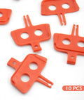 Orange plastic 10 Pack Bike Disc Brake Pad Spacers And Pad Spreader Tool For Hydraulic Disc Brakes on white background