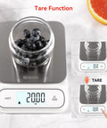 Waterproof IPX6 Kitchen Scale With Backlit Display, showing tare function, stainless steel platform with blueberries jar