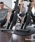 Double Sided Anti Slip Exercise Bike Mat With PVC Silicone Texture For Hardwood Floor Protection And Rock Solid Grip Foldable Home Gym Pad For Cycling And Weight Lifting Black under exercise bike showing secure grip.