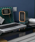 Portable Indoor Space Heater 1000 Watts High Output With Two Heat Settings, desk heater on black surface next to laptop