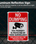 Large No Dumping Sign Keep Off My Patch Property Protected By Video Surveillance Reflective Aluminum Plate mounted on a fence.