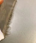 Close-up of 4 Inch By 10 Foot RV Roof Sealant Tape That Permanently Stops Leaks, Waterproof And UV Weatherproof, showing adhesive side.