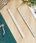 No Sweat 16 Piece Plastic Drawer Slides Replacement Side Mounted Runners Fits 17mm Groove, two white runners on wood surface.