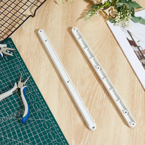No Sweat 16 Piece Plastic Drawer Slides Replacement Side Mounted Runners Fits 17mm Groove, two white runners on wood surface.