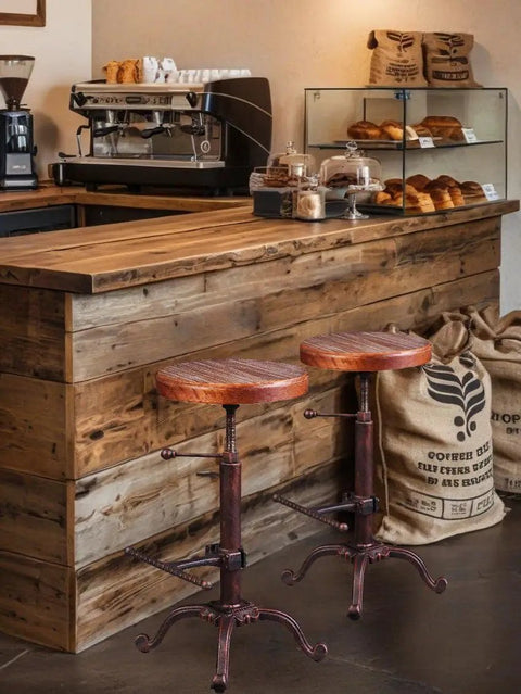 Industrial Retro Farm Tractor Stool Swivel Height Adjustable Bar Stool For Kitchen Counter Copper Finish Cast Iron Frame With 13 Inch Pine Seat Durable Comfortable Workhorse For Home Bar And Casual Dining in a rustic cafe setting