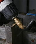 Rotary Diamond Grinding Burr Bit, 6mm Shank, close-up on cylindrical rounded head working on metal surface
