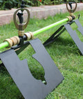 Genuine Real Deal Rooftop Sprinkler System For Wildfire Ember Defense with metal base, 360 degree spray head on grass.