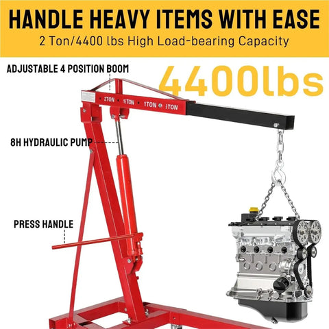 Badass 2 Ton Hydraulic Engine Hoist 4000 Lb Capacity Folding Cherry Picker with adjustable boom and 8H hydraulic pump lifting an engine.