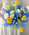 Person holding bouquet using Blue Cellophane Flower Wrapping Paper Pack for Florists and DIY Peeps, Gift Box Wrapping, Table Coverings, Scrapbooking.