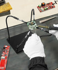 Helping Hands Soldering Station With 4 Flexible Arms Soldering Kit for Electronics being used with circuit boards on a workbench