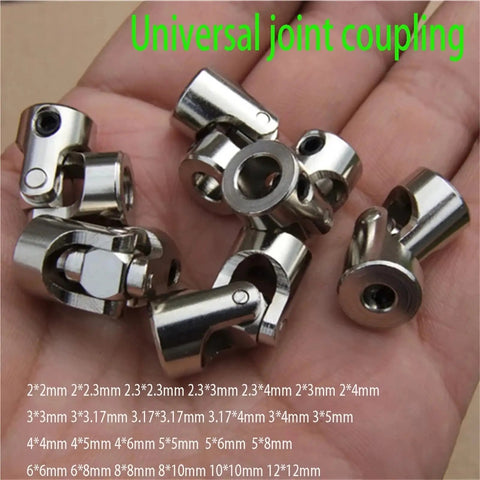Heavy Duty 6mm Metal Universal Joint Shaft Coupler For RC Car Gimbals And Motor Connexions Fits 2 To 10mm Sizes laid out in hand.