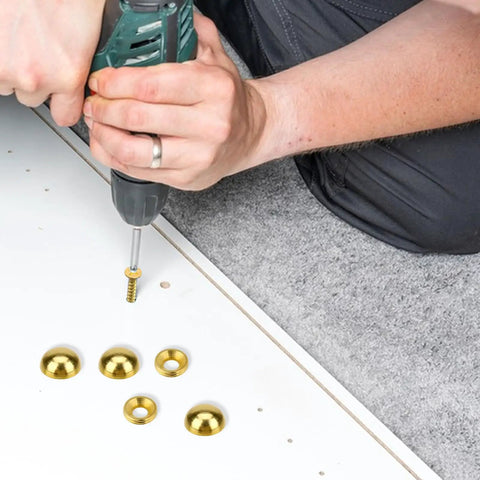 Person using a drill to secure Pure Brass Decorative Screw Covers With Smooth Caps Heavy Duty Self Tapping Bolts for Furniture And Mirror Repairs.