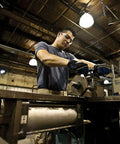 Man using Do It Yourself Drill And Tap Set For Quick Metal Threads With Quarter Inch 20 NC Tap And Thirteen Sixty Fourth Inch Drill Bit