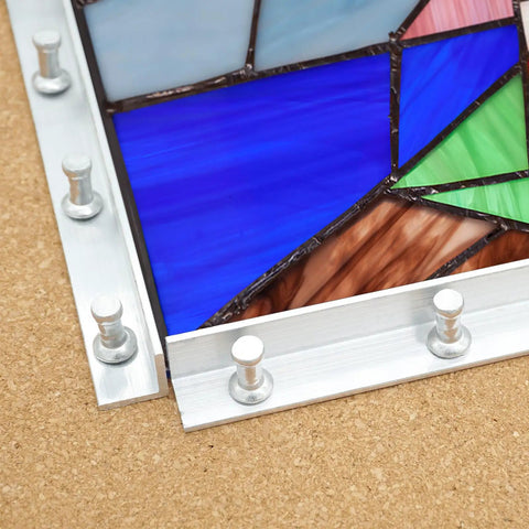 Professional Stained Glass Layout Block System With 80 Push Pins to Keep Your Panels Dead Square close-up of blue and green glass segments