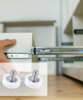 Close-up of a hand installing a drawer with Six Piece Set Of 19mm White Plastic Drawer Rollers Featuring Slick Cabinet Pulleys.