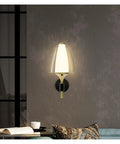 Straight Up Modern Led Wall Sconce With Soft Glowing Acrylic Shade lights up a wall in a stylish living area.
